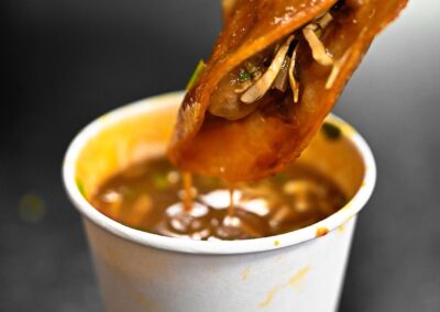 dipping taco on sauce