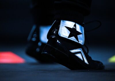 a block boxing shoes with a logo