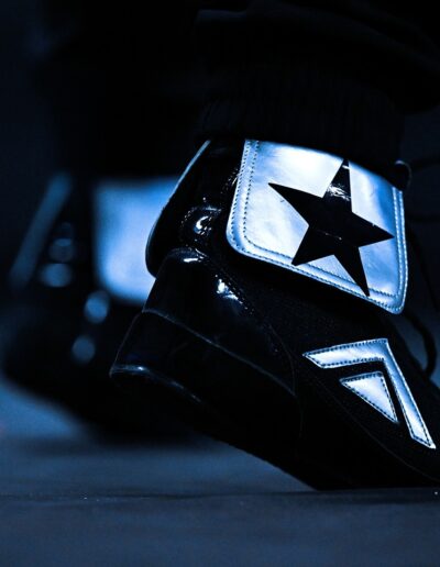 a block boxing shoes with a logo