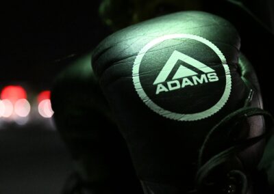 a black gloves with a logo